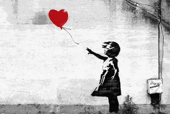 Unmasking Banksy: The Enigmatic Street Artist Redefining Contemporary Art